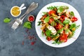 Fresh vegetable salad plate of tomatoes, spinach, pepper, arugula, chard leaves and grilled chicken breast. Fried chicken meat, fi Royalty Free Stock Photo
