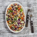 Fresh vegetable salad with red cabbage, carrots, sweet peppers, herbs and seeds. Healthy vegetarian food. Royalty Free Stock Photo