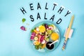 Fresh vegetable salad with red cabbage, cucumber, radish, carrots, sweet peppers, red onion and parsley Royalty Free Stock Photo