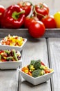 Fresh vegetable salad in white bowl. Spring party table. Royalty Free Stock Photo