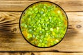 Fresh vegetable soup in glass bowl on wooden table. Top view Royalty Free Stock Photo