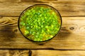 Fresh vegetable soup in glass bowl on wooden table. Top view Royalty Free Stock Photo