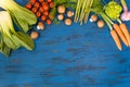 Fresh vegetables on blue, old wooden background Royalty Free Stock Photo