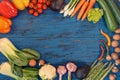 Fresh vegetables on blue, old wooden background Royalty Free Stock Photo