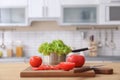 Fresh vegetables and blurred view of kitchen interior