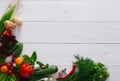 Fresh vegetables border on white wood background with copy space