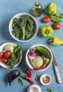 Fresh vegetables - broccoli, peppers, tomatoes, eggplant, squash, turnips on a blue background, top view. Royalty Free Stock Photo