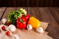 Fresh vegetables, bulgarian pepper, lettuce, garlic, mushrooms, cherry tomatoes and spices