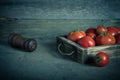 Fresh vegetables in a burned rustic texture box for background. Rough weathered wooden board. Toned Royalty Free Stock Photo