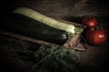 Fresh vegetables in a burned rustic texture box for background. Rough weathered wooden board. Toned Royalty Free Stock Photo