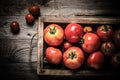 Fresh vegetables in a burned rustic texture box for background. Rough weathered wooden board. Toned Royalty Free Stock Photo