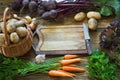 Fresh vegetables from carrot, beetroot, onion, garlic, potato on old wooden board. Top view. Copy space. Royalty Free Stock Photo