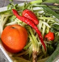 fresh vegetables consisting of pieces of pumpkin, tomatoes, cloves