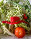 fresh vegetables consisting of pieces of pumpkin, tomatoes, cloves