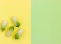 Fresh vegetables, cucumber  on green yellow background. Healthy food concept. Flat lay, top view Royalty Free Stock Photo