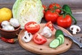 Fresh vegetables on a cutting board with a knife Royalty Free Stock Photo