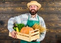 Fresh vegetables delivery service. Fresh organic vegetables box. Farmer hipster straw hat deliver fresh vegetables. Man Royalty Free Stock Photo