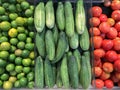 Fresh vegetables farmer market sell cucumber, tomato and lime. Royalty Free Stock Photo