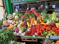 Fresh vegetables on a fruit stand in an outdoor store in London many different vegetables and fruits Royalty Free Stock Photo