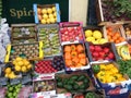 Fresh vegetables and fruits in boxes outside local store UK