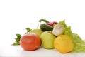 Fresh vegetables, fruits and greens on a white background, tomato, lemon, lettuce, cucumber, garlic, pepper, Apple Royalty Free Stock Photo