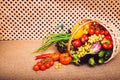 Fresh vegetables, fruits and lettuce in wicker basket. Royalty Free Stock Photo