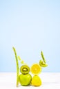 Fresh Vegetables and Fruits such as Lemon, Kiwi, Asparagus and Celery. Equilibrium floating food. Balance. Copy Space. Royalty Free Stock Photo