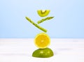 Fresh Vegetables and Fruits on Table. Equilibrium floating food. Such as Kiwi, Lemon, Avocado, Asparagus. Balance. Copy Royalty Free Stock Photo