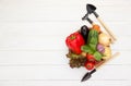 Fresh vegetables and garden tools on white wooden board.Gardening and agriculture concept Royalty Free Stock Photo