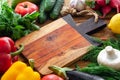 Fresh vegetables and healthy ingredients, wooden cutting board Royalty Free Stock Photo