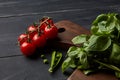 Fresh vegetables and herbs on a dark wooden background. Royalty Free Stock Photo