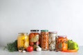 Fresh vegetables and jars of pickled products Royalty Free Stock Photo