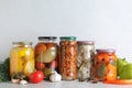 Fresh vegetables and jars of pickled products Royalty Free Stock Photo