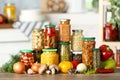 Fresh vegetables and jars of pickled products on table Royalty Free Stock Photo