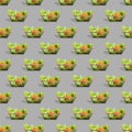 Fresh vegetables in a metal shopping cart. Seamless pattern of shopping baskets isolated on gray background. Royalty Free Stock Photo