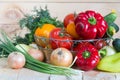 Fresh vegetables from new harvest in wicker basket on wooden background. Royalty Free Stock Photo