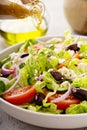 Fresh vegetables and feta greek salad with homemade dressing