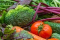 Fresh vegetables are prepared for the vegetable dish: broccoli and tomatoes Royalty Free Stock Photo