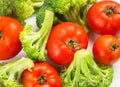 Fresh vegetables are prepared for the vegetable dish: broccoli and tomatoes Royalty Free Stock Photo