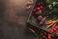 Fresh vegetables, radish, tomato, carrot, beetroot, peas in wooden box on dark background. Freshly bunch harvest. Healthy organic Royalty Free Stock Photo