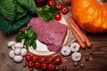 Fresh vegetables and raw meat on a sacking Royalty Free Stock Photo