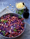 Fresh vegetables salad with purple cabbage, carrot, sprouted mung, parsley on grey clay plate on dark background. Cole Slaw Salad Royalty Free Stock Photo