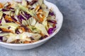 Fresh vegetables salad with purple cabbage, white cabbage, lettuce, carrot on white plate Royalty Free Stock Photo