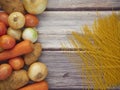 Fresh vegetables and spaghetti lines on old wooden tables Royalty Free Stock Photo