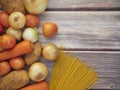 Fresh vegetables and spaghetti lines on old wooden tables Royalty Free Stock Photo