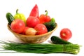 Fresh vegetables sweet bell peppers, cucumbers, tomatoes, onions in basket white background Royalty Free Stock Photo