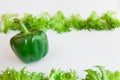 Fresh vegetables - sweet green pepper and leaves of frillis. Bell peppers. Royalty Free Stock Photo