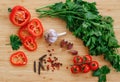 Fresh vegetables on the table. Food background. Flat lay. Cherry tomatoes, a bunch of parsley, chopped red pepper, garlic Royalty Free Stock Photo