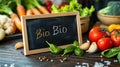 fresh vegetables on the table plate for text with the inscription bio