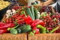 Fresh vegetables: tomatoes, cucumbers, lettuce, peppers, champignons in the basket at the street farm market Royalty Free Stock Photo